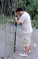 4) Using a metal bar for planting